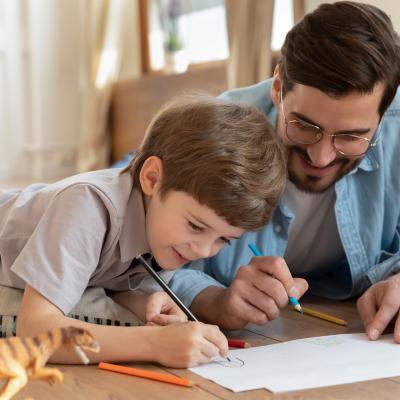 Man and boy drawing